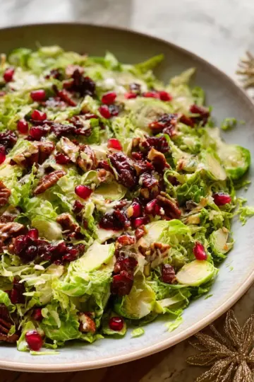 Shaved Brussels Sprout Salad with Pomegranate and Candied Pecans